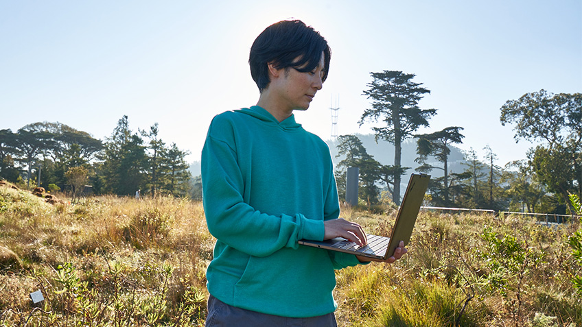 In field working on laptop