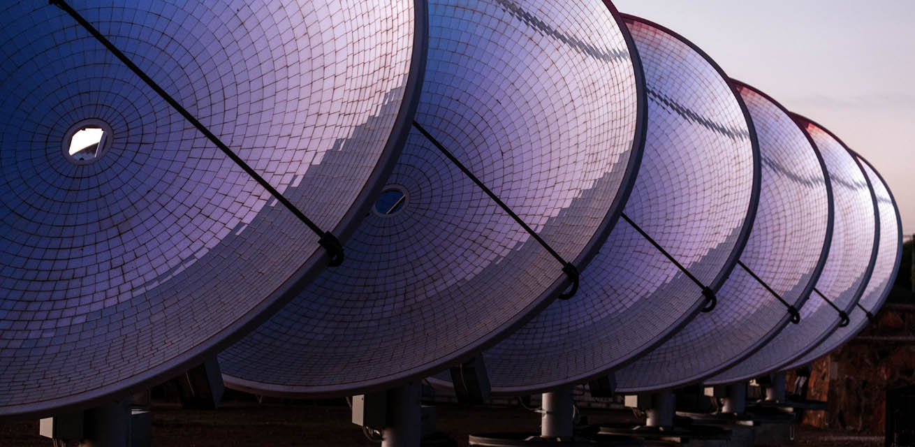 A row of circular, convex, solar absorption panels