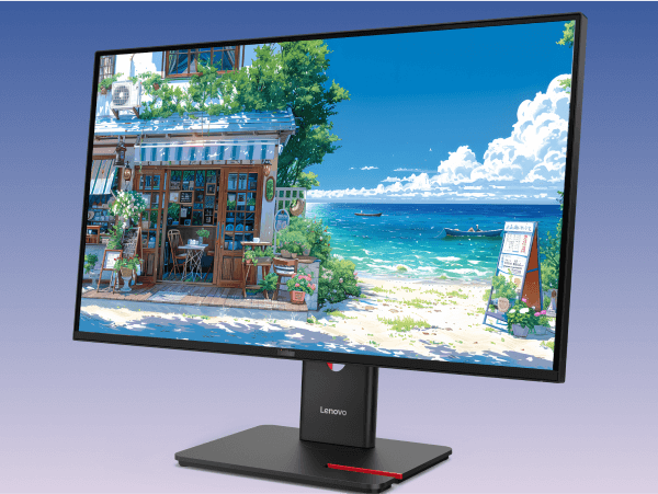 A Lenovo ThinkVision monitor shows an image of a painting of a quaint seaside shop in the foreground, with a beach and two canoes in the ocean in the background.