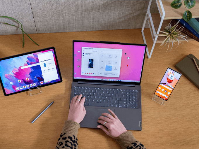 Overhead shot of someone using a laptop, tablet and smart phone together