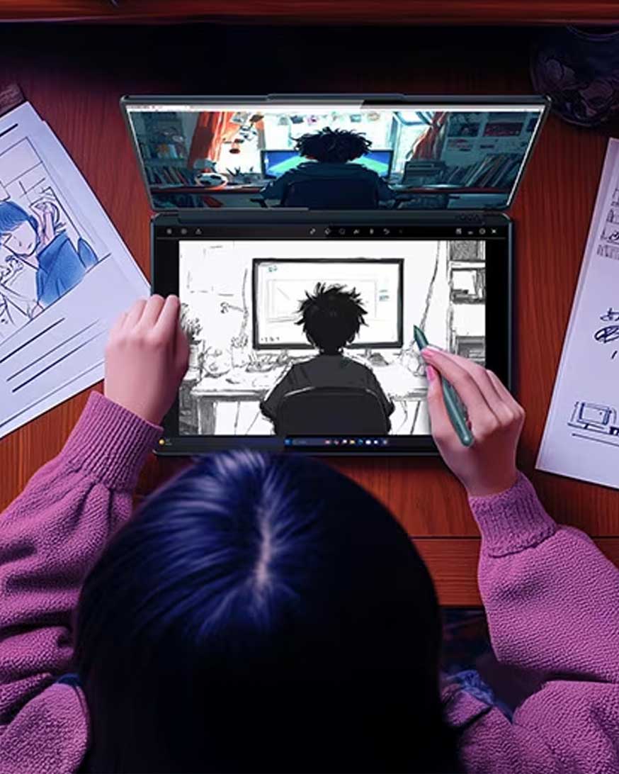 An artist drawing with their laptop and Stylus pen. 