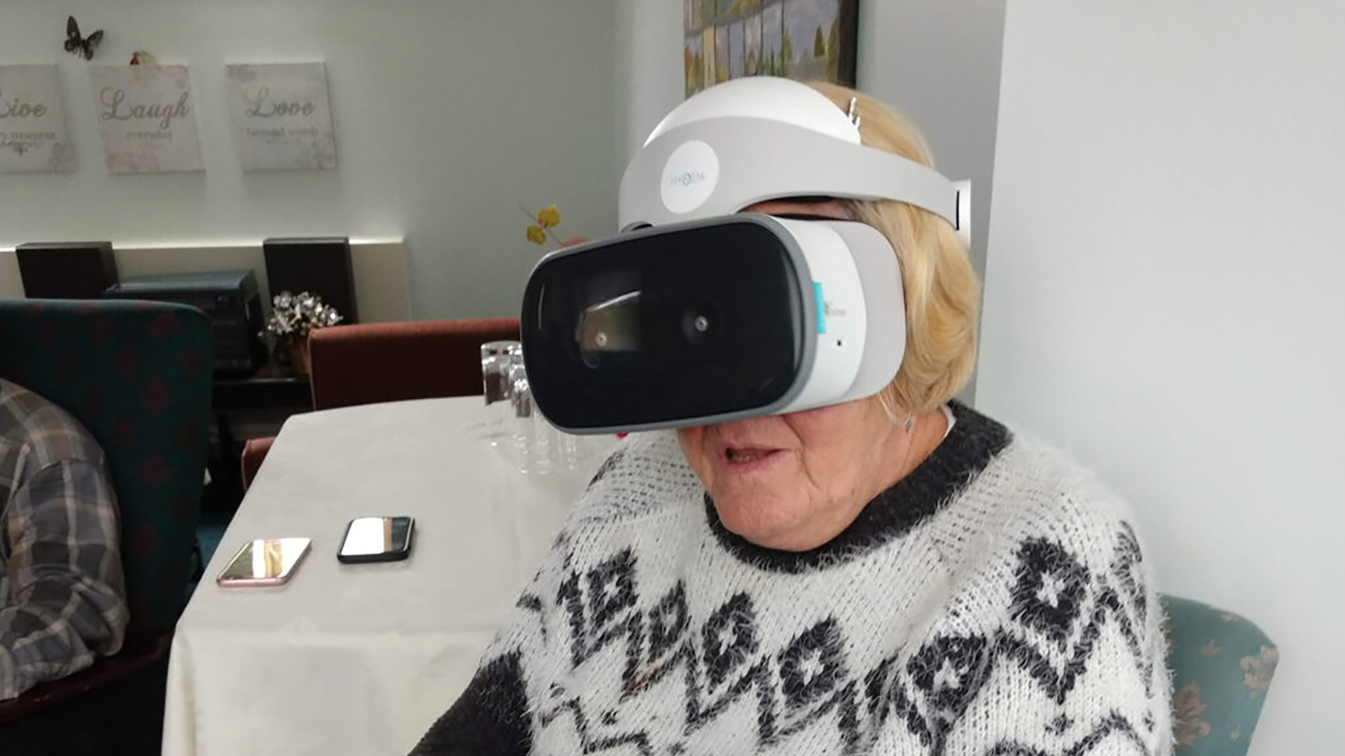 An elderly person experiencing virtual reality