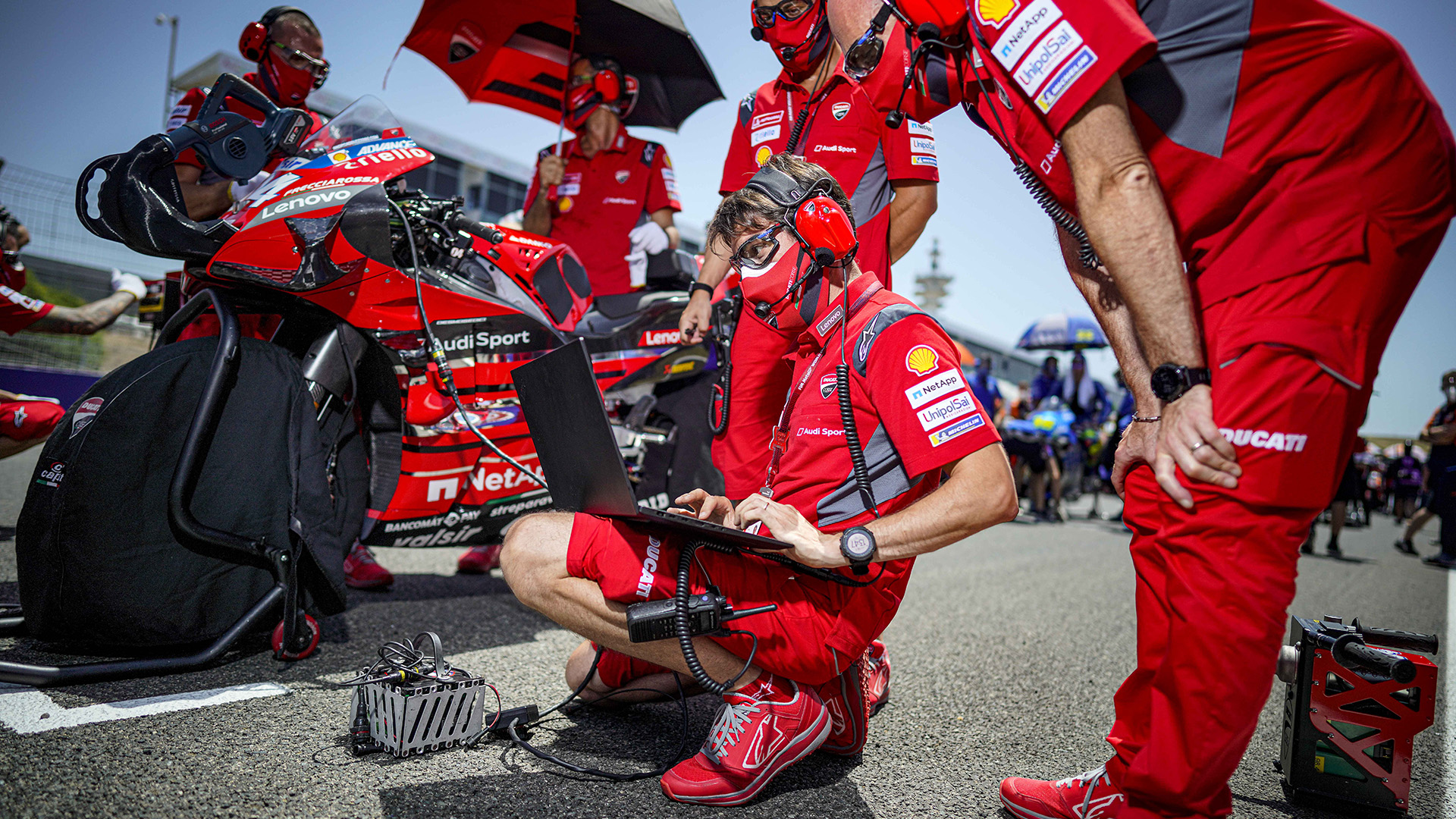 Ducati team using ThinkPad laptop by the racetrack