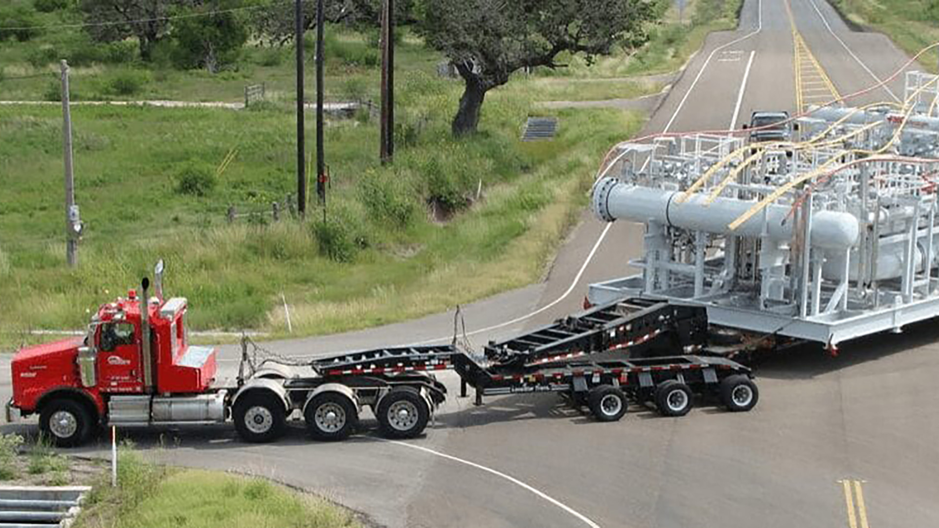 Lone Star transportation carrying heavy, wide-load equipment 