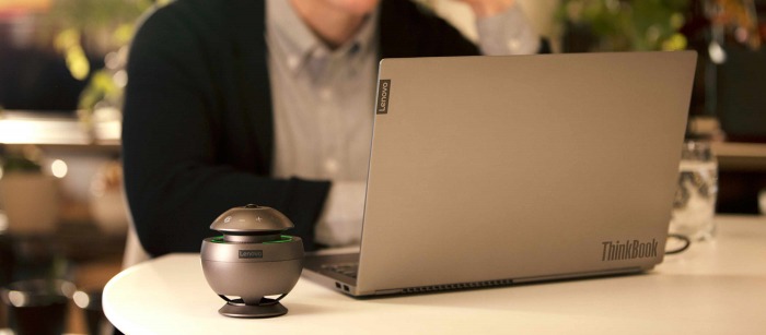 A woman in her house using a laptop for a virtual meeting