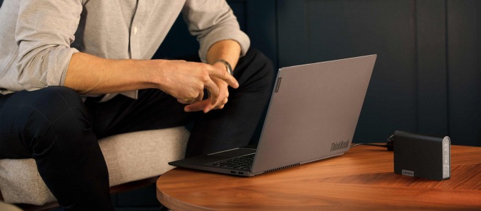 A young man playing a game on his laptop