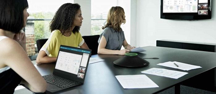 A young man playing a game on his laptop