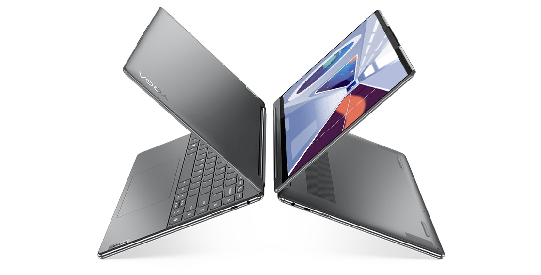 Twee Yoga 9i Gen 8 2-in-1-laptops, Oatmeal, met achterkanten naar elkaar, geopend in laptopstand onder een hoek, waardoor de letter X ontstaat