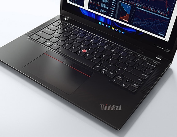 Close-up of portions of the keyboard & display of a ThinkPad X13 Gen 4 laptop