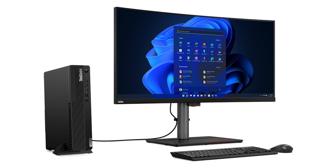 Left side view of Lenovo ThinkCentre M90s Gen 3 (Intel) small form factor desktop PC, stood vertically, alongside monitor, keyboard, and mouse (all sold separately)
