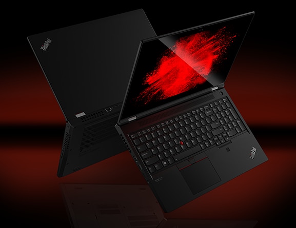 Two back-to-back Black Lenovo ThinkPad T15g Gen 2 laptops floating midair, open 90 degrees, showing keyboard, display, and partial back-side.