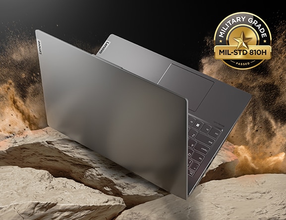 Side view of semi-open IdeaPad 5i Gen 7 laptop PC on a rugged stone background.