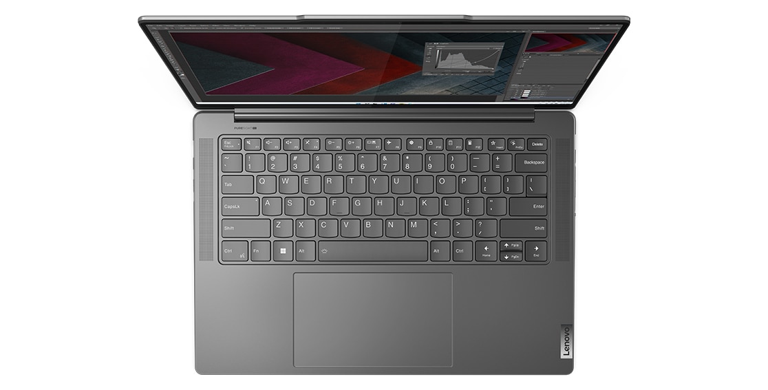 Top-down view of Yoga Pro 7 Gen 8 laptop’s keyboard with photo editing software open on the display