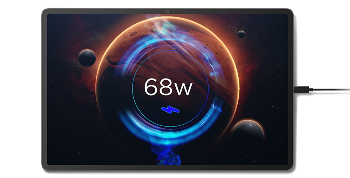 Aerial view of Lenovo Tab Extreme tablet, laid flat, with screen showing animated space scene with planets and the wording: 68w