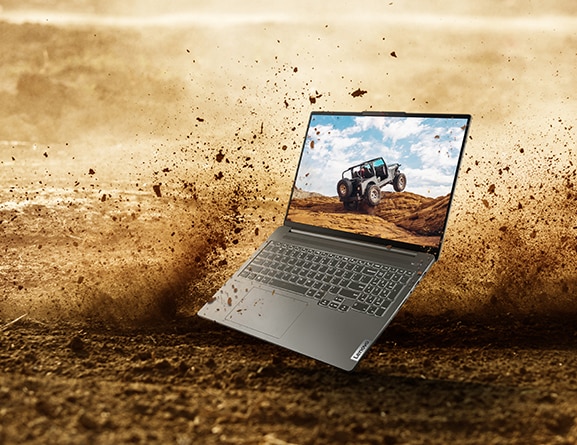 An opened IdeaPad Pro 5 Gen 8 (16'' intel) with an offroading jeep pictured on the display, set against a background closeup of the dirt racetrack