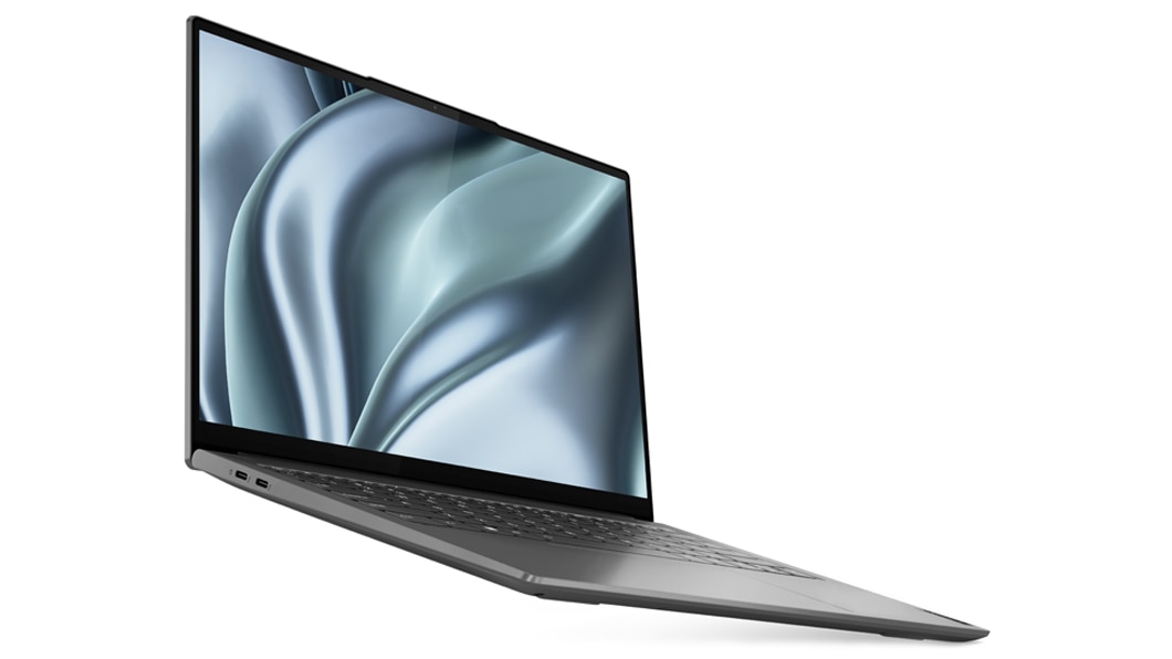 Vista frontal hacia la derecha del portátil Lenovo Yoga Slim 7i Pro de 7.ª generación abierto 180 grados, con la pantalla y el teclado visibles