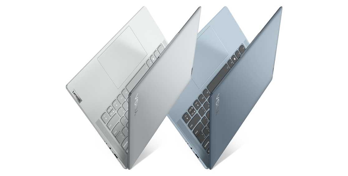 Side view of two Lenovo Yoga Slim 7i Pro X Gen 7 (14″ Intel) laptops, opened slightly at an angle in a V-shape, one Dark Teal color, the other Cloud Grey