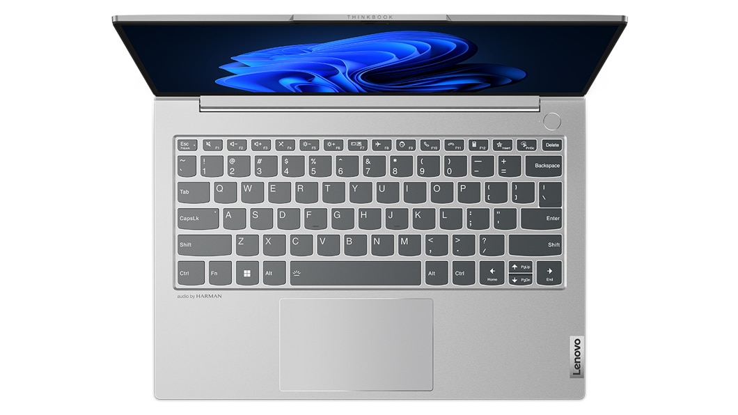 Overhead shot of Lenovo ThinkBook 13s Gen 4 laptop in Cloud Grey, with focus on keyboard.