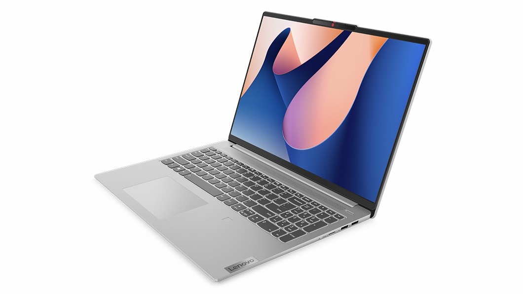 Vista del lato destro del notebook IdeaPad Slim 5i di ottava generazione con tastiera, schermo con logo Windows 11 Bloom e porte sul lato destro