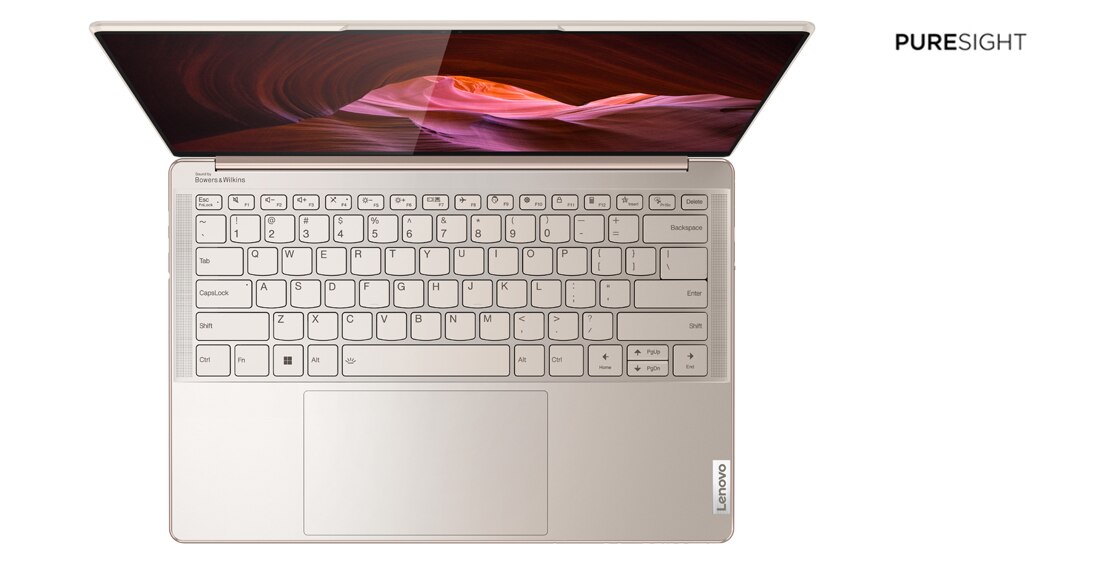 Aerial view of Lenovo Yoga Slim 9i Gen 7 (14″ Intel) laptop, opened, showing keyboard, trackpad, and display
