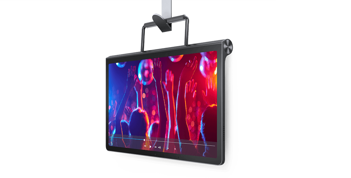 Lenovo Yoga Tab 11 tablet—3/4 right-front view, suspended by kickstand from a hook, with video of party- or concert-goers on the display