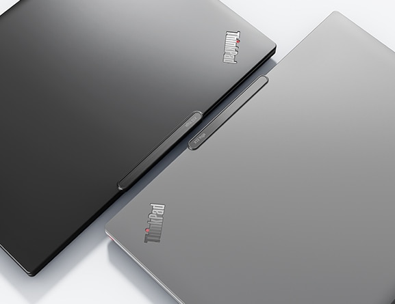 ThinkPad X13 Yoga Gen 4 2-in-1 laptops in Deep Black and Storm Grey, both closed and sitting back-to-back