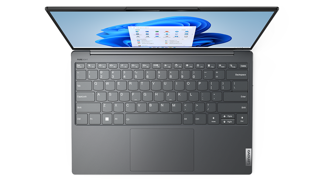 Yoga Slim 7i Carbon Gen 7 set ovenfra med visning af tastatur, Windows 11 på skærmen