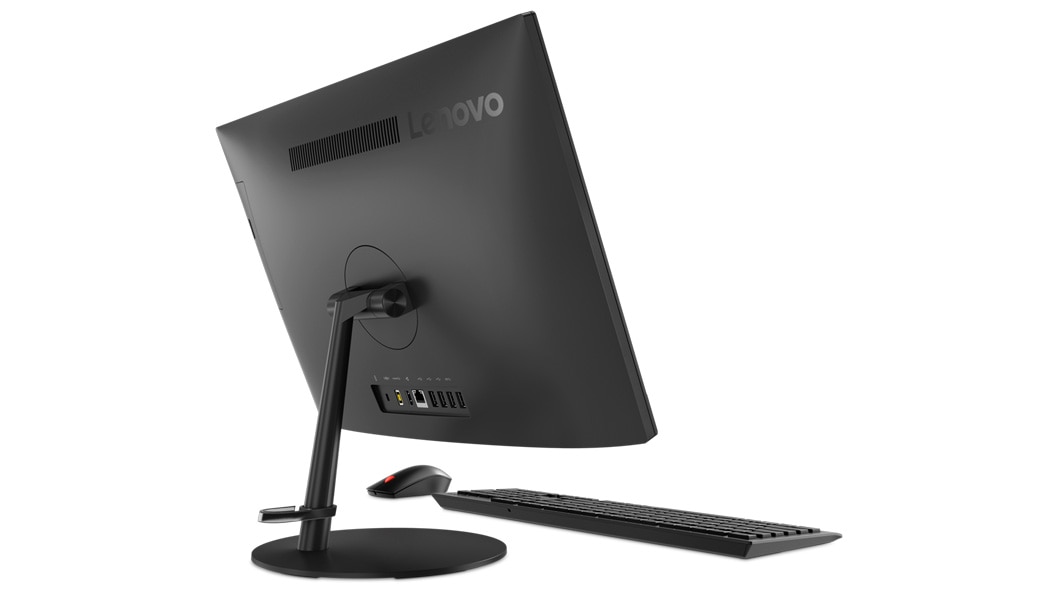 Lenovo V130 AIO in black, rear view showing some ports and the cable-tidy hook, plus mouse and keyboard