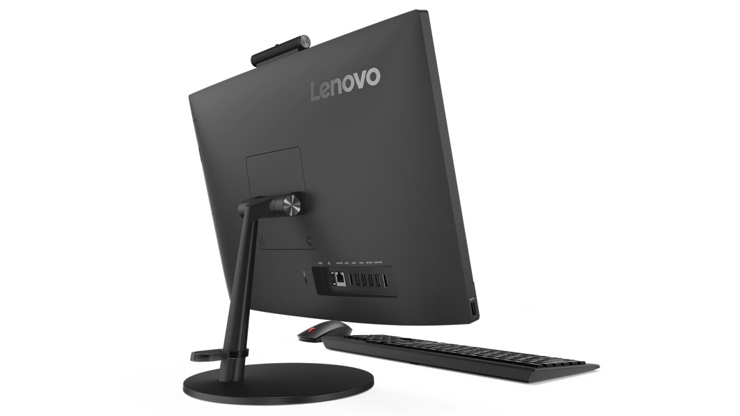 Lenovo V530 AIO rear shot, showing the stand and rear ports, plus keyboard and mouse.