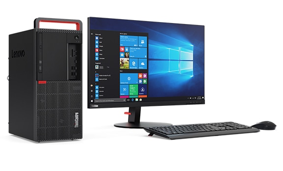 Side angled view of Lenovo ThinkCentre M920 Tower alongside monitor, wireless keyboard and mouse