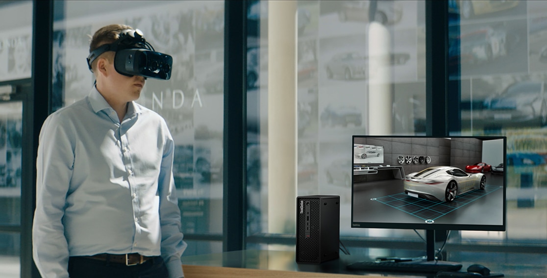 Person with VR headset alongside the Lenovo ThinkStation P360 Ultra workstation on a desk with monitor.