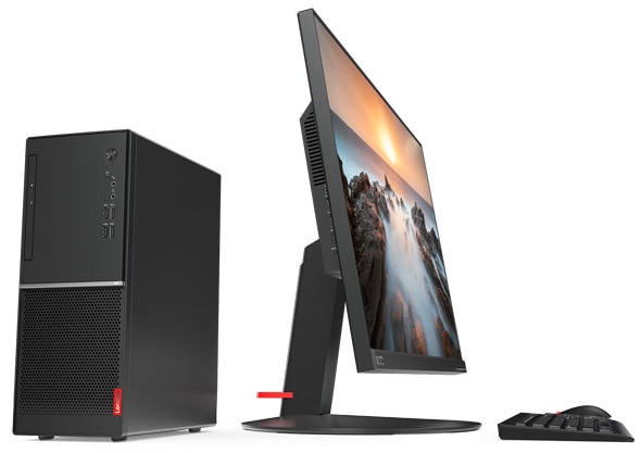 Lenovo V330 Tower Desktop. Shot showing the fromt and rightside of the tower, alongside a display and keyboard