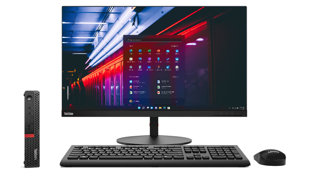 Lenovo ThinkCentre M920 Tiny next to desktop, wireless keyboard and mouse