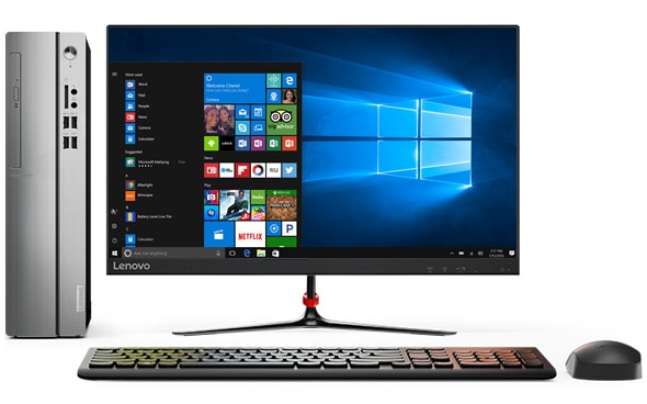 Head-on shot of Lenovo Ideacentre 310s small form factor PC alongside monitor with Windows 10 Home, wireless keyboard, and mouse. 