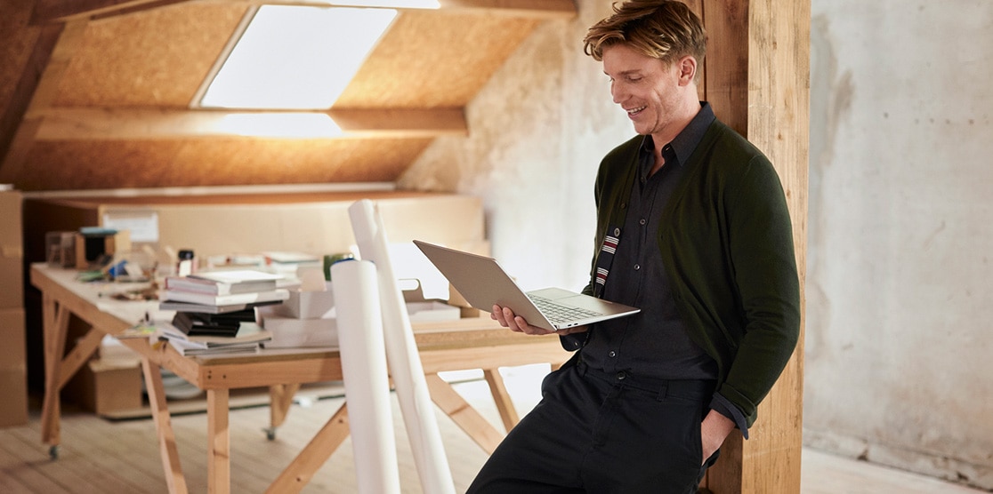 Shot of a young man in an architect's studio holding his Lenovo IdeaPad S540 
