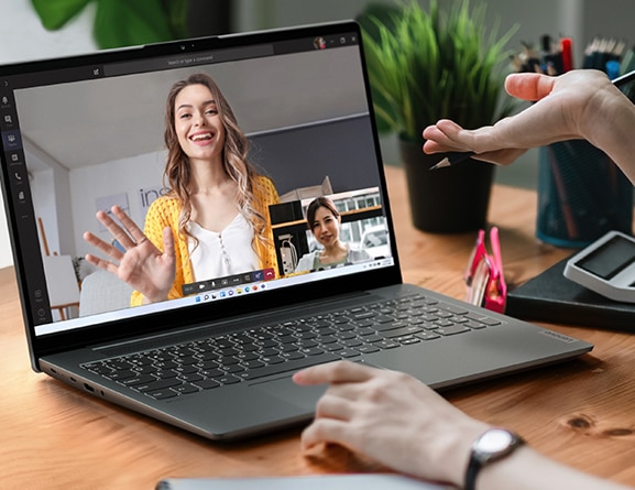 A person using Lenovo IdeaPad 5 Gen 7 laptop PC for video conferencing.