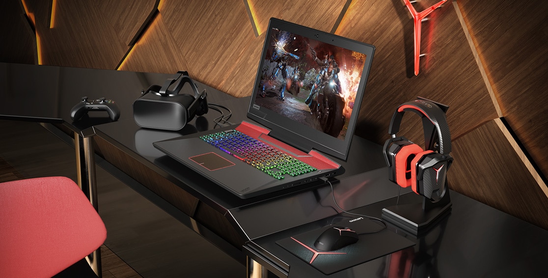 Lenovo Legion Y920 atop a desk and surrounded by numerous gaming accessories