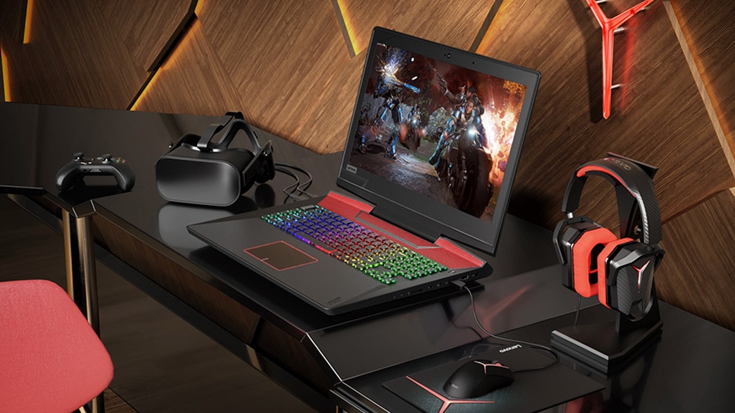 Lenovo Legion Y920 atop desk and surrounded by multiple gaming accesories
