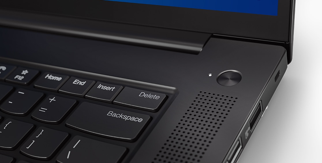 Detail of power button with integrated fingerprint reader on the Lenovo ThinkPad X1 Extreme Gen 4 laptop.