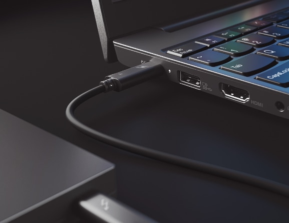 Closeup of power cable plugged into black Lenovo ThinkPad E15 Gen 2 Thunderbolt port 