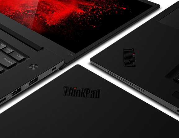 Shot of ThinkPad P1 open 180 degrees next to two ThinkPads with close-up of logo 