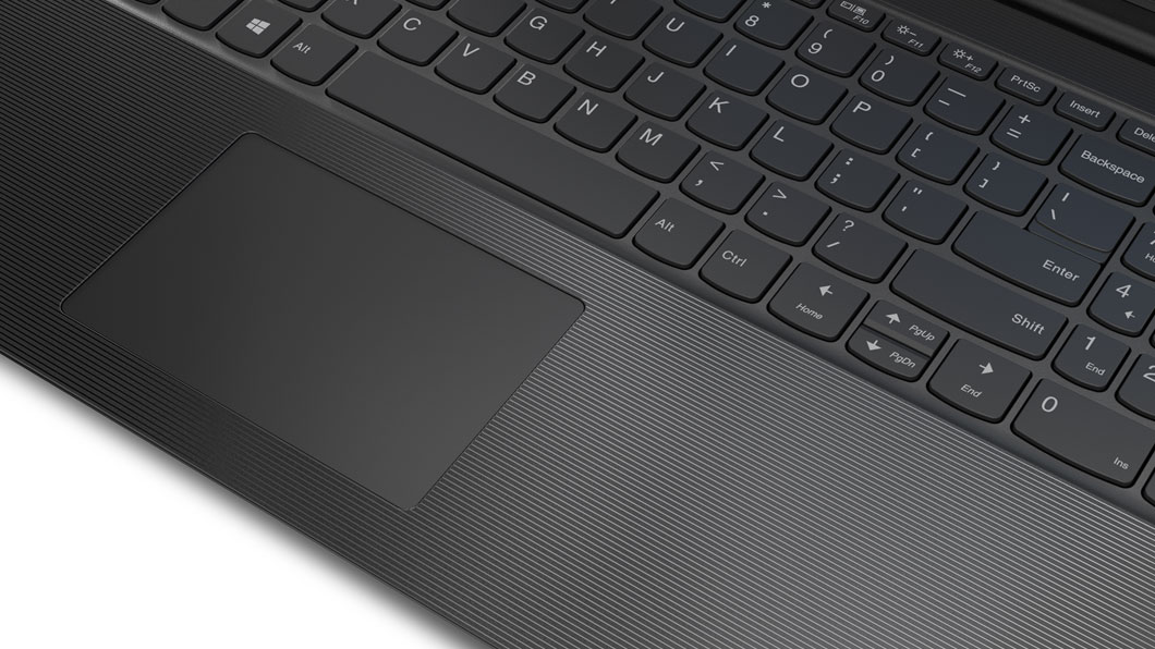 Detail of Lenovo V130 (15) one-piece touchpad and textured pattern alongside.