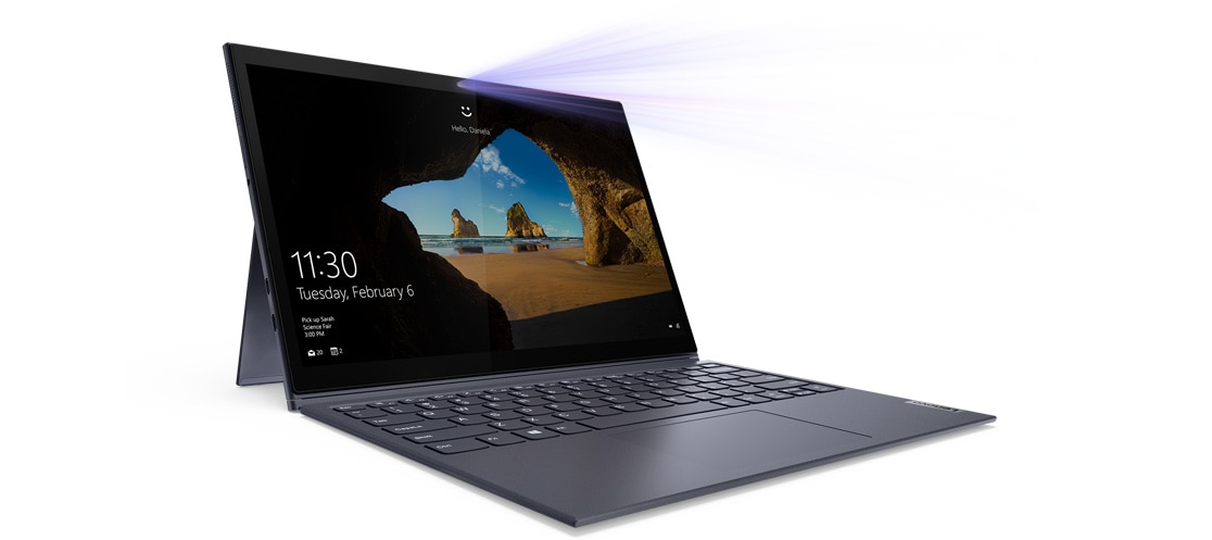 An open Yoga Duet 7i, showing the Windows 10 Home screensave and the date and time