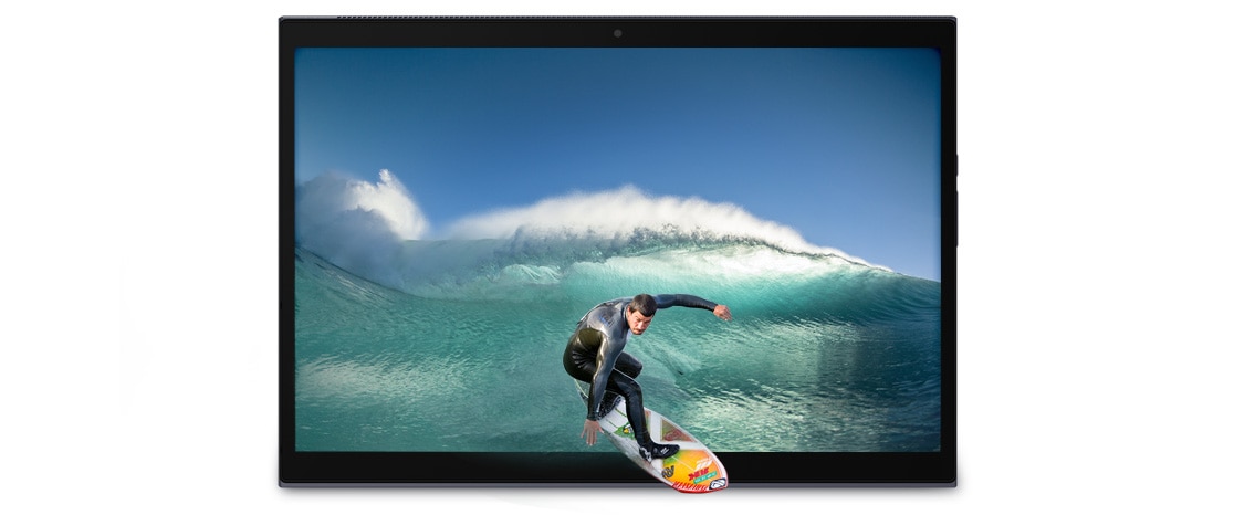 A Yoga Duet 7i in tablet mode, showing an ocean and a surfer appear to be surfing out of the screen