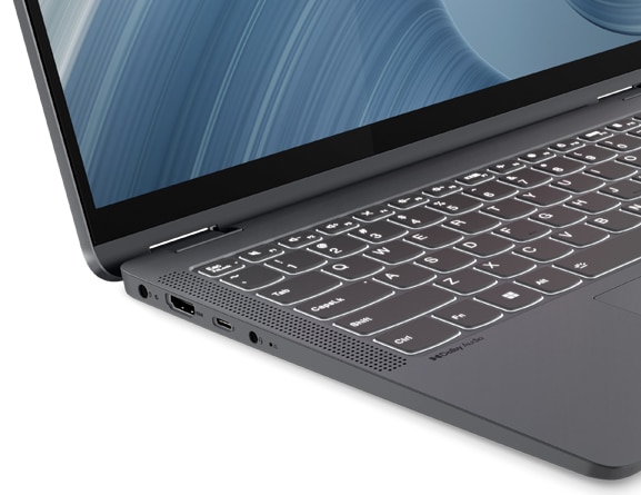 Top-angled closeup of the left-side hinge on the 14” IdeaPad Flex 5i, showing the left-side ports and parts of the display and backlit keyboard