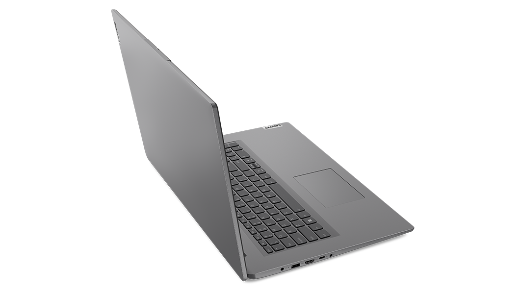 Aerial view of Lenovo V17 Gen 3 laptop, open 180 degrees at an angle, showing edge of top cover & part of keyboard