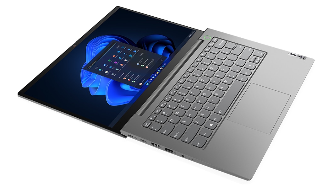 Ansicht eines geöffneten Lenovo ThinkBook 14 Gen 4 (Intel) Notebooks von schräg oben links, flach liegend, mit Blick auf Tastatur, Trackpad und Display