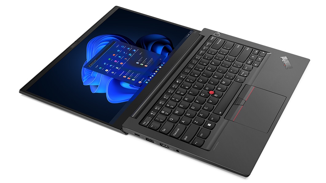 Aerial, left side view of Lenovo ThinkPad E14 Gen 4 (14” AMD) laptop, laid flat, opened 180 degrees, showing display and keyboard