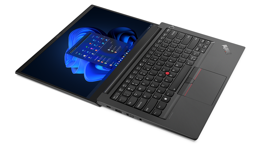 Vista aérea del portátil empresarial ThinkPad E14 de 4.ª generación, abierto en un ángulo de 180 grados, en posición plana, mostrando el teclado y la pantalla con Windows 11