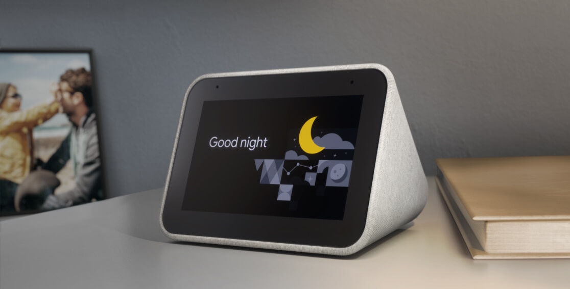 Lenovo Smart Clock with the Google Assistant on a nightstand, showing an activated 'Good night' routine.